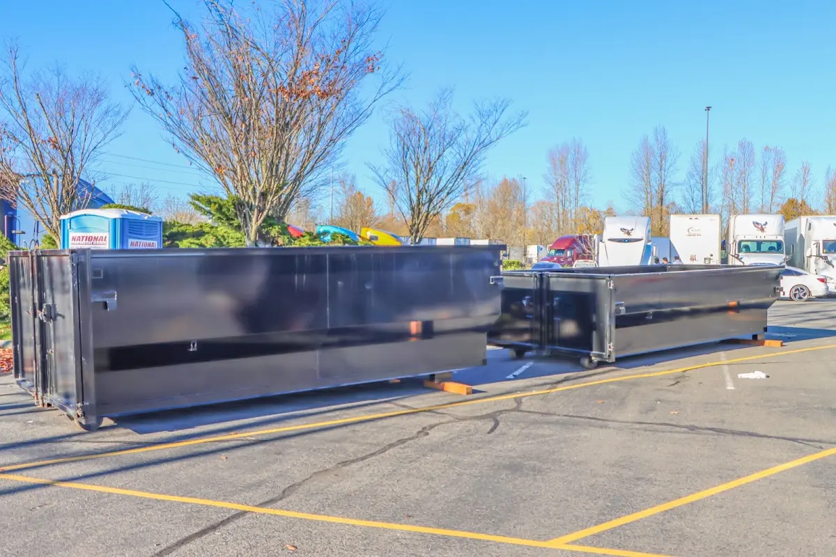 Professional dumpster rental service with roll-off container on residential driveway in Irvine